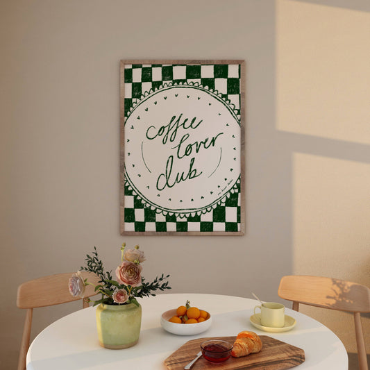 Coffee lover club print typography on a round scalloped plate with a green checkerboard background.  