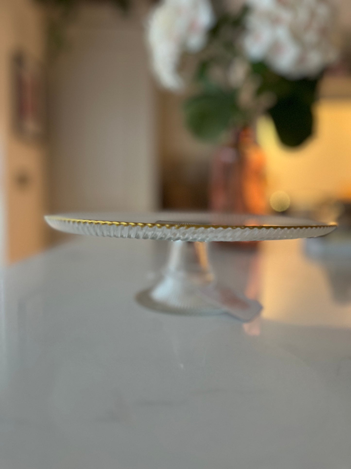 Gold rimmed ribbed glass cake stand