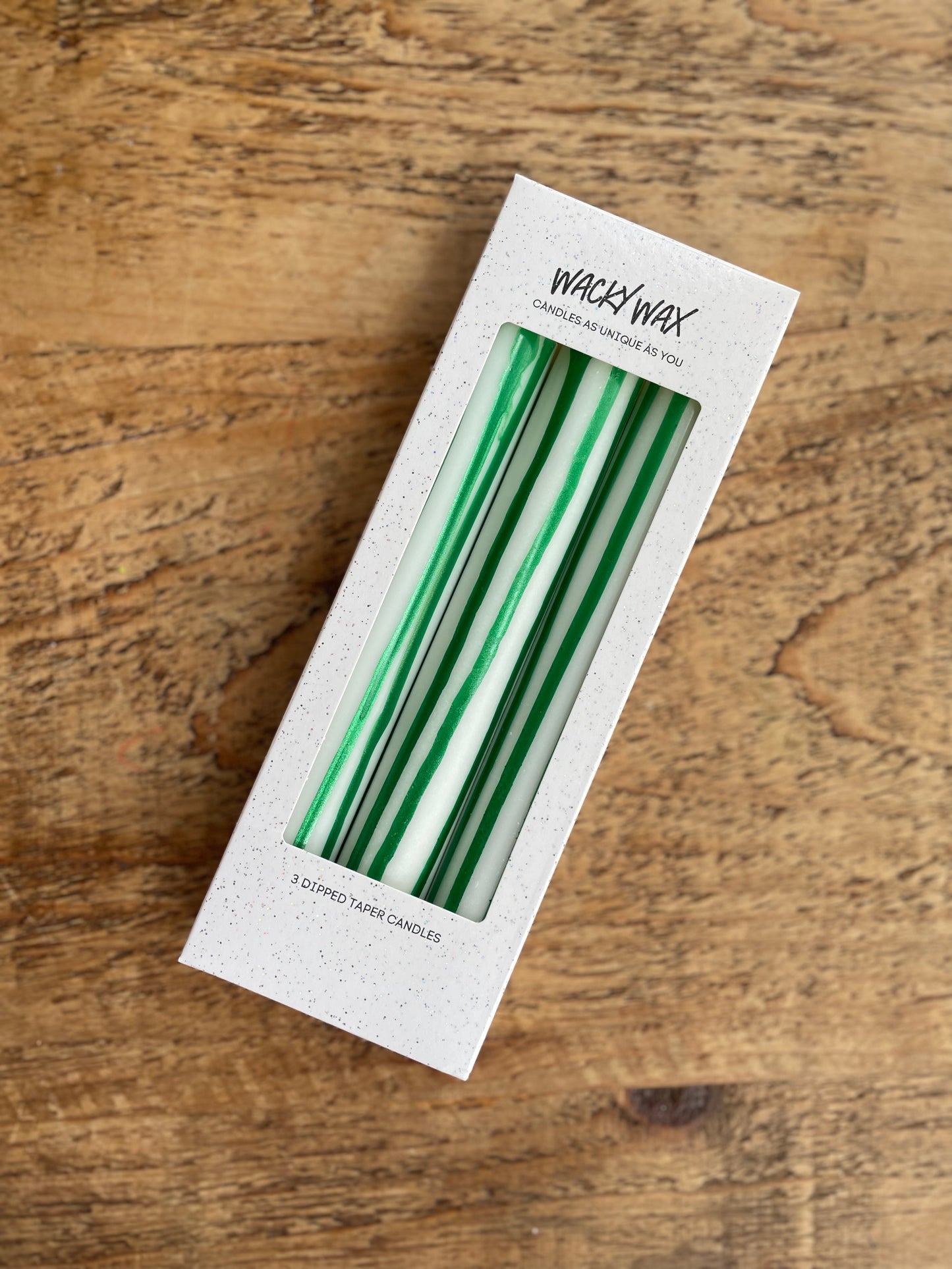 Green and white vertical striped candles