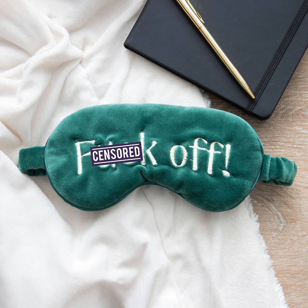 Green velvet eye mask embroidered with the words f*ck off!